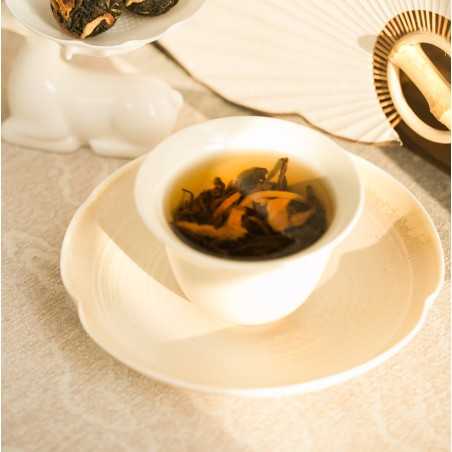 Black tea balls with orange bark