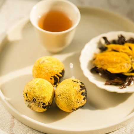 Black tea balls with yellow chrysanthemum